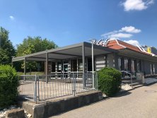 Mc-Donalds-Satteldorf-Terrassenueberdachung-Sonnenschutz